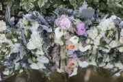 Bridesmaid-Piled-Bouquets